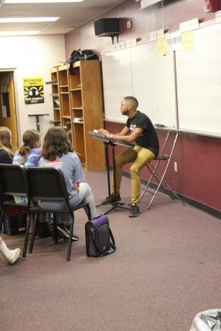 Mr. Stone works with the middle school to help develop music reading/ playing skills.