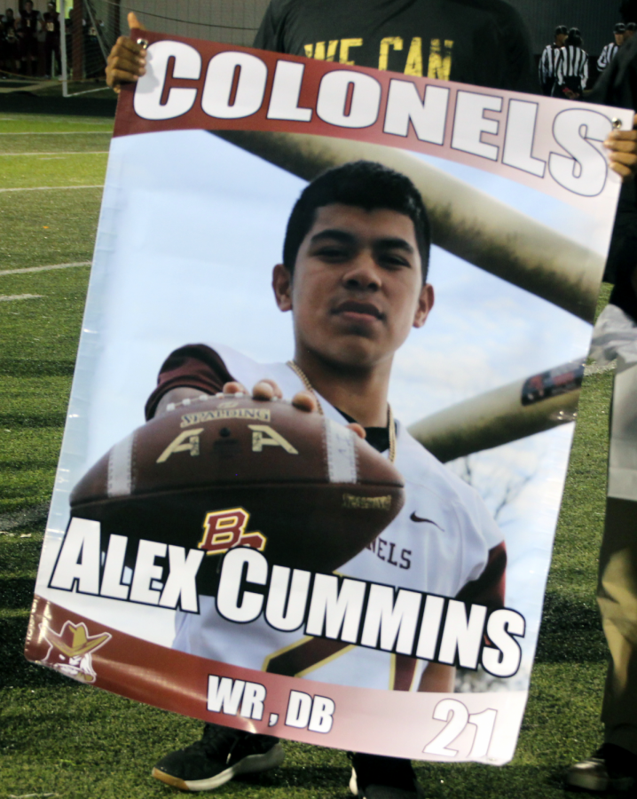 Number 21, Alex Cummins, who was injured and could not attend Friday night. He was still recognized; Here his banner is held by one of the coaches. 