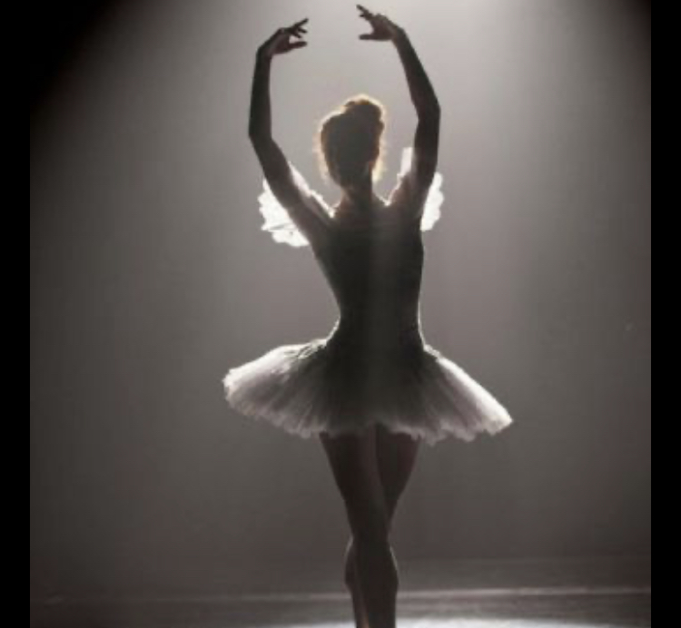 Dancer prepares herself to take the stage as the ballet begins. 