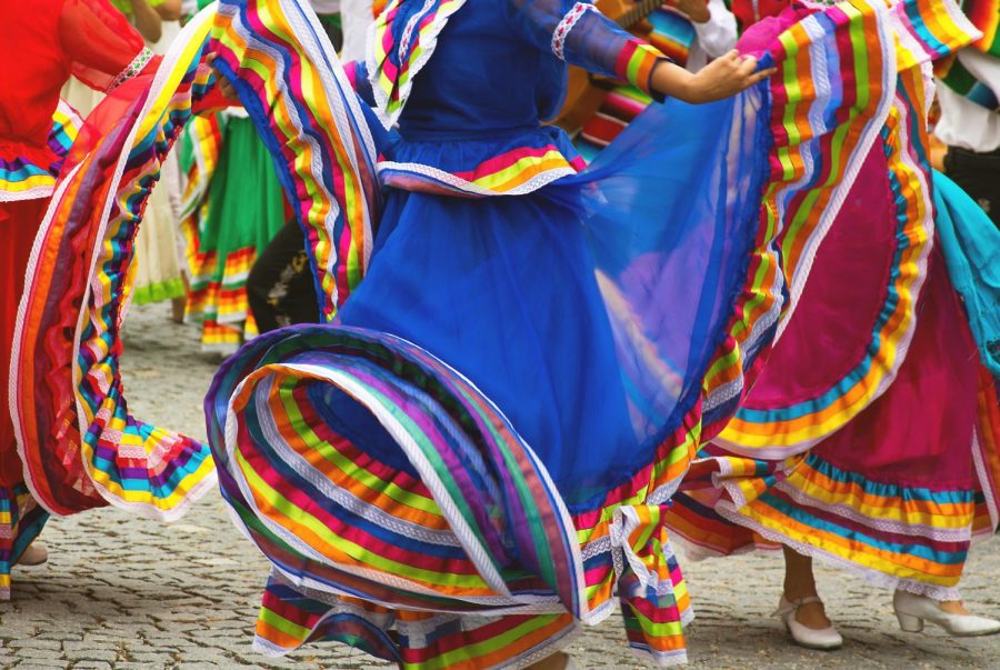 Hispanic dancers in colorful dresses! this is very normal in Hispanic cultures!