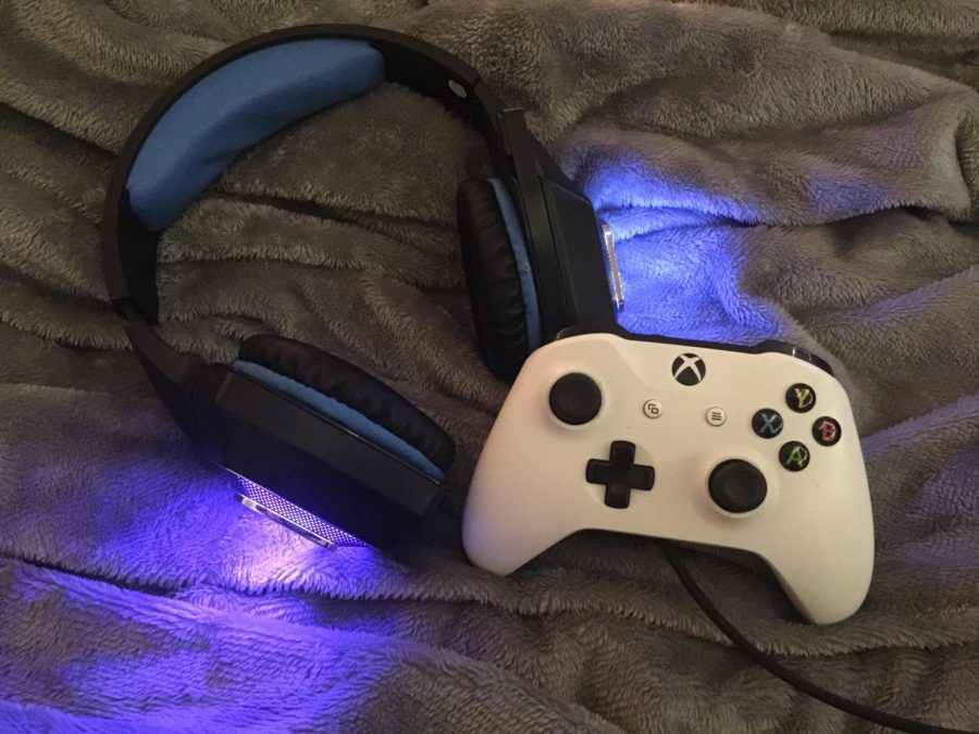 Video game essentials including controller and headset