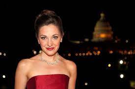 Laura Osnes standing in front of the Capitol Building 