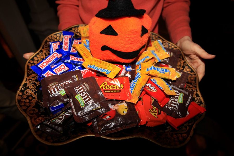 Halloween candy being handed out by an unknown person. 