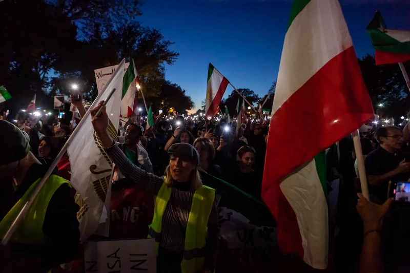 Protestors wave the flag of the old Iranian Republic calling for an end to the current dictatorship.