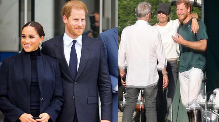 A picture of Prince Harry with Megan Markle and Sarah Ann Macklin 