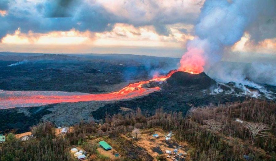 A picture of a Super Volcanic eruption as its flowing lava begins to ruin the communities