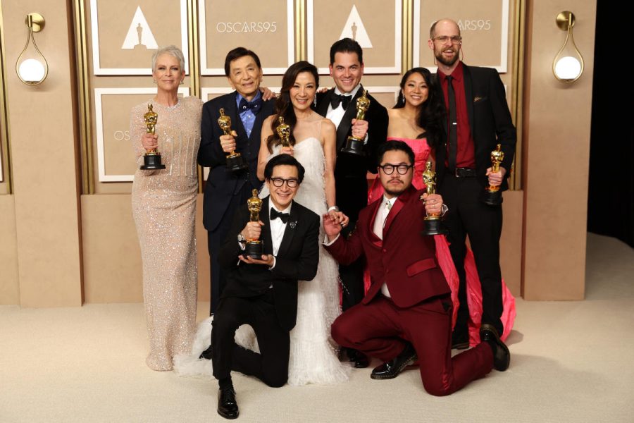 Daniel Kwan, Daniel Scheinert and Jonathan Wang pose with the Oscar for Best Picture for Everything Everywhere All at Once. 