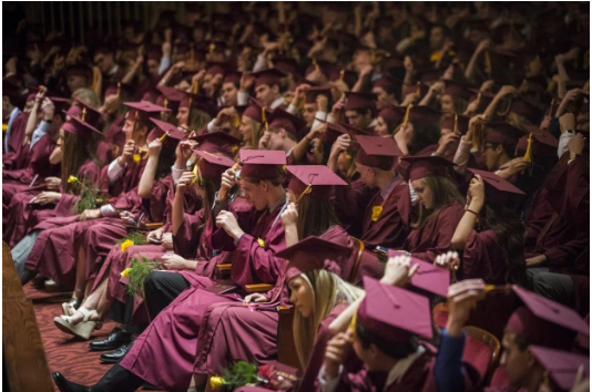 A photo of a senior class getting ready to graduate and begin the next chapter of their lives.