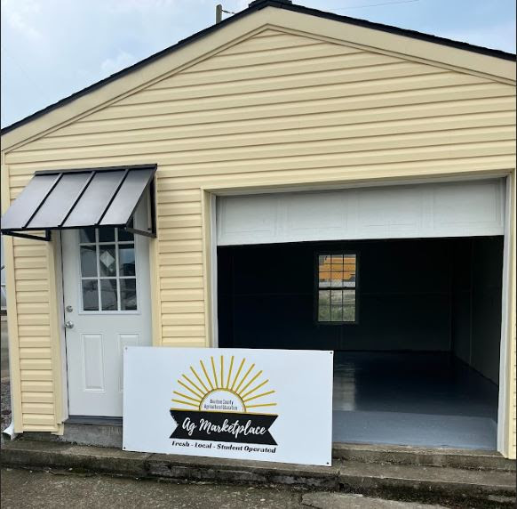 The pre-existing garage that was turned into a student-operated farmers market. The marketplace features a few students SAEs, such as Annabella Bengies dog treat business, Millis Dog Treats. 