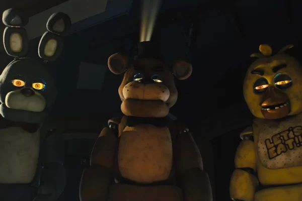 A photo from the FNAF movie, featuring the three main animatronics, Bonnie, Freddy, and Chica. 