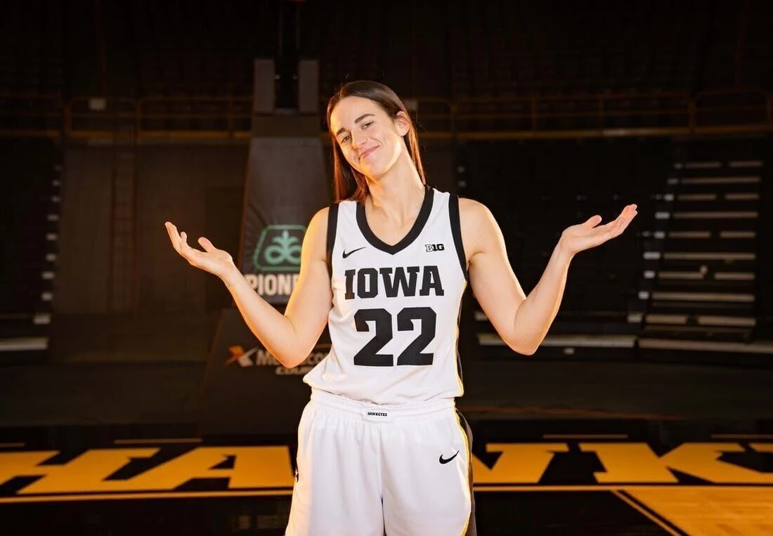 Caitlin poses for media pictures showing off her famous number 22. 
