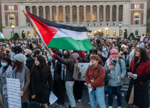 Students at Columbia University raise the Palestinian flag.